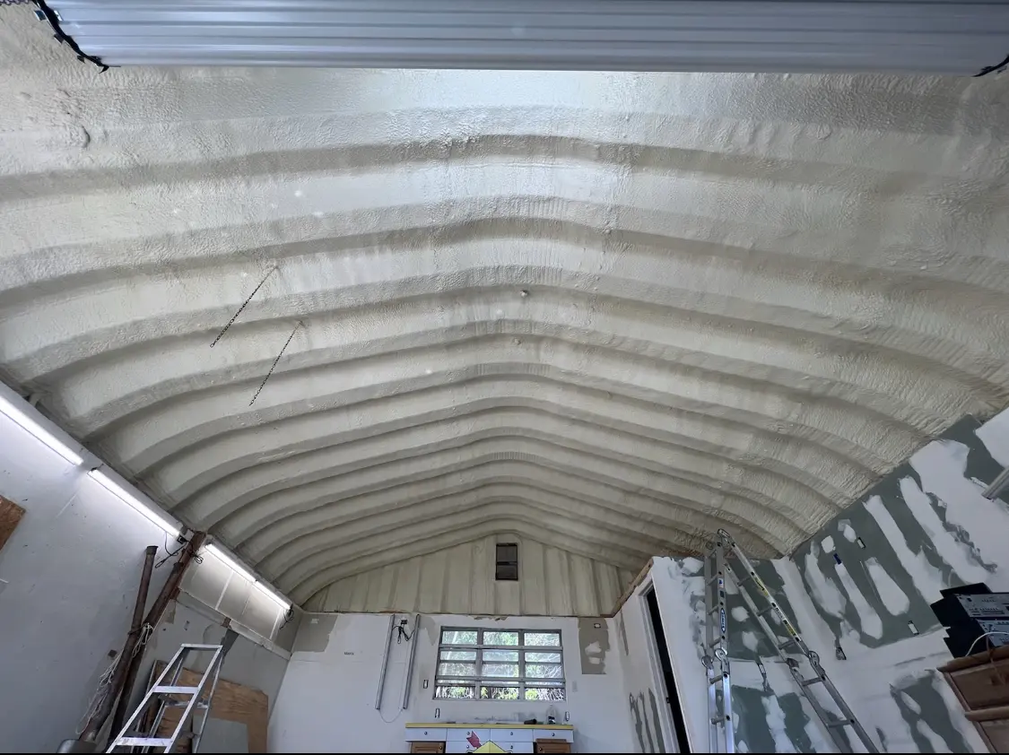 Spray polyurethane foam applied to the underside of a metal roof deck in Belle Plaine